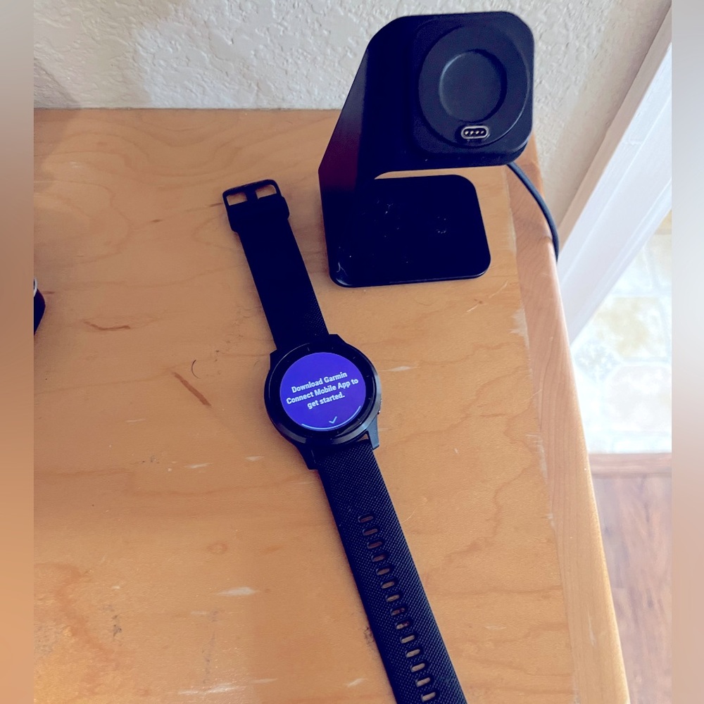 Garmin vivoactive 4 smart watch with stand